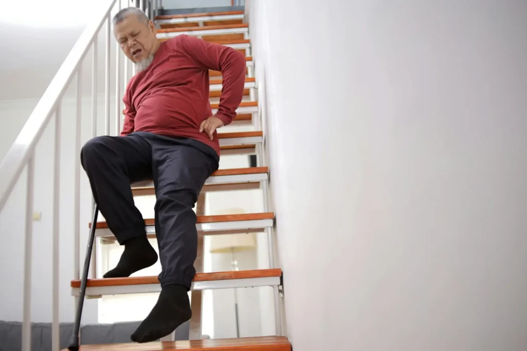 elderly person who has experienced a fall while navigating a staircase